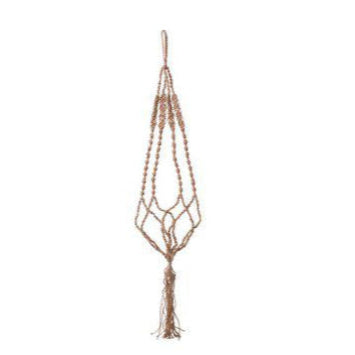 Macrame plant hanger with tassels on a white background